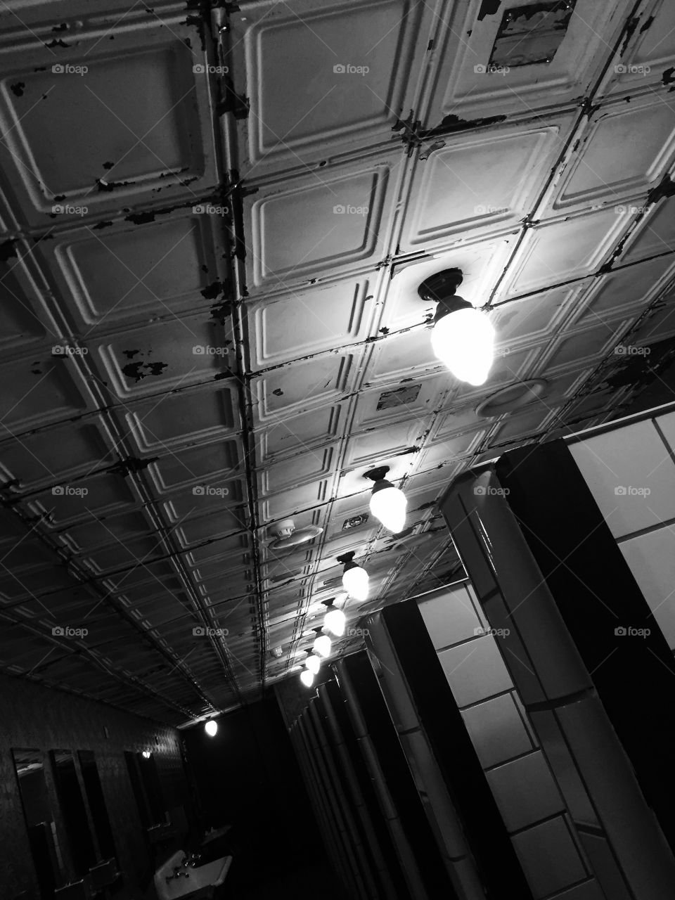 Black and white ceiling London public toilets