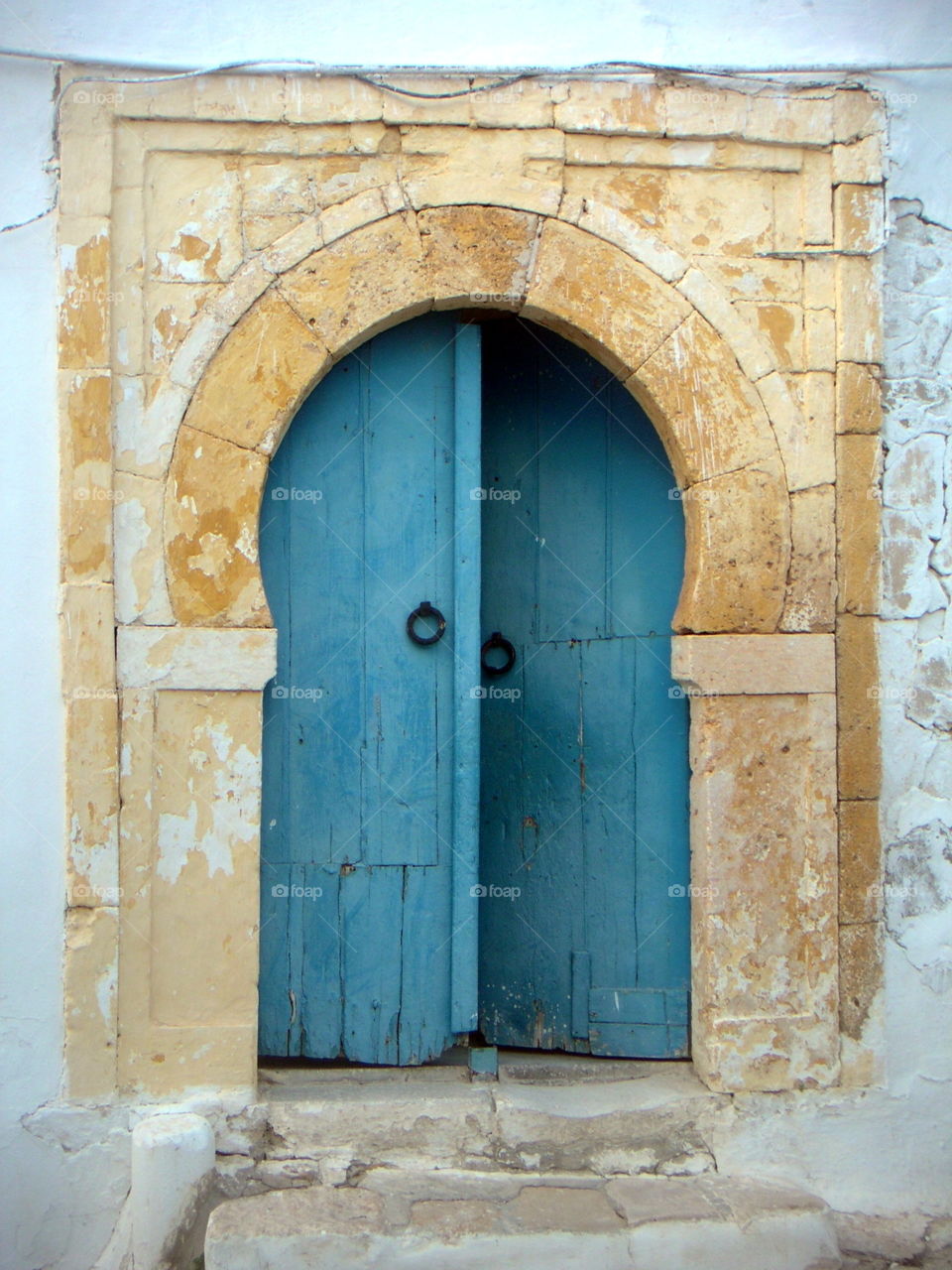 blue door in a tunisian village
