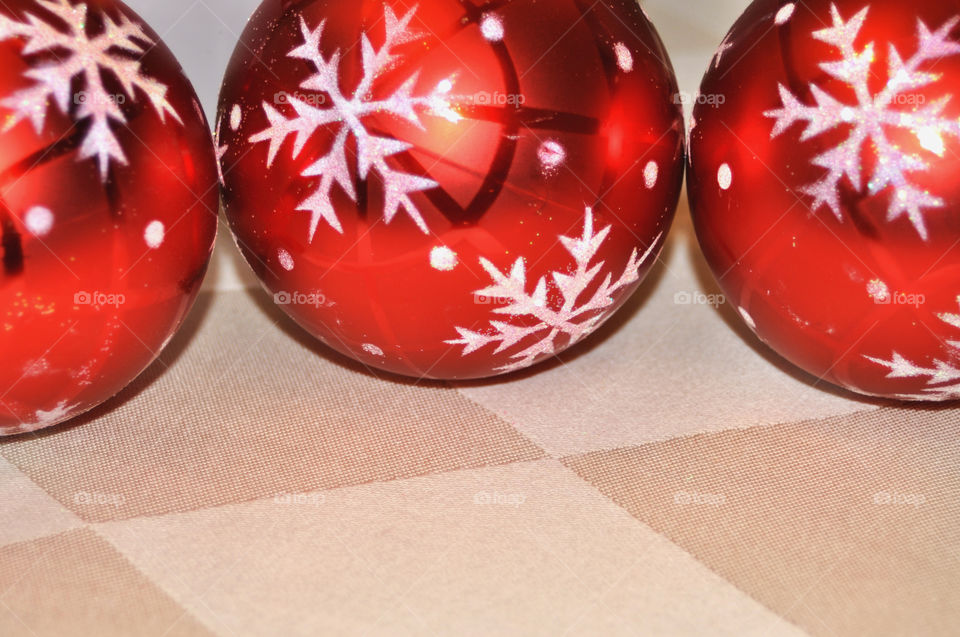 Close up of three red Christmas balls room for your text. 