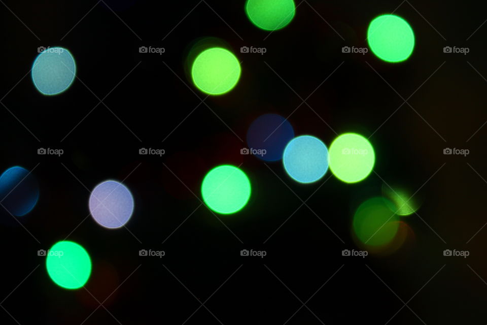 Macro shot of Christmas tree decorations and vivid lights