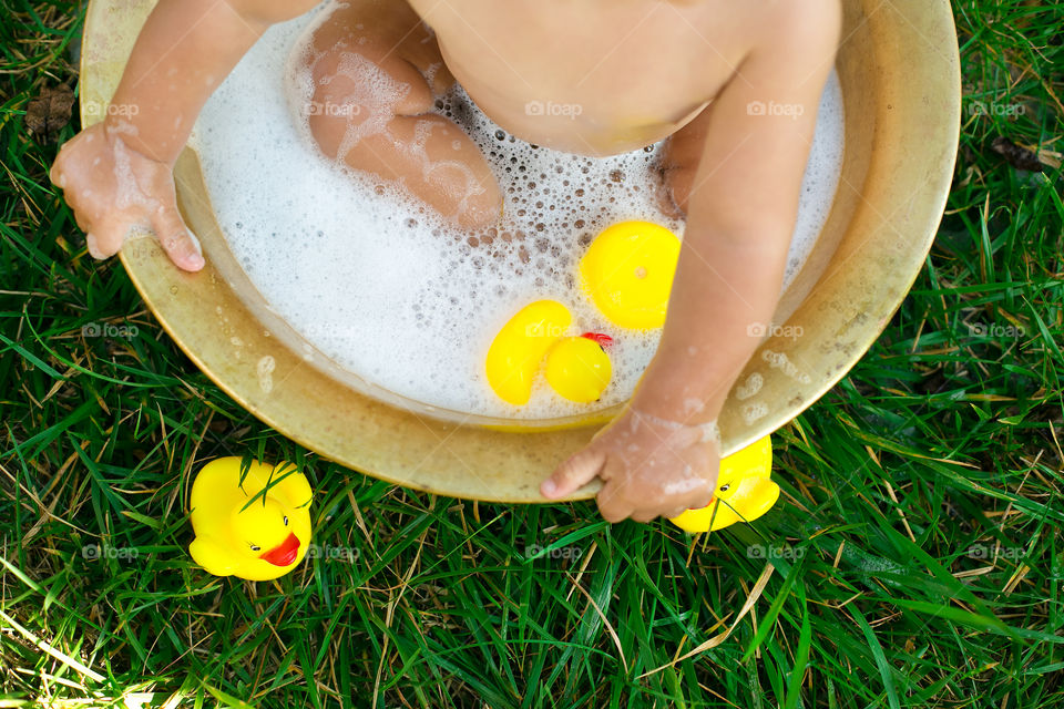 Baby taking a bath at outdoors