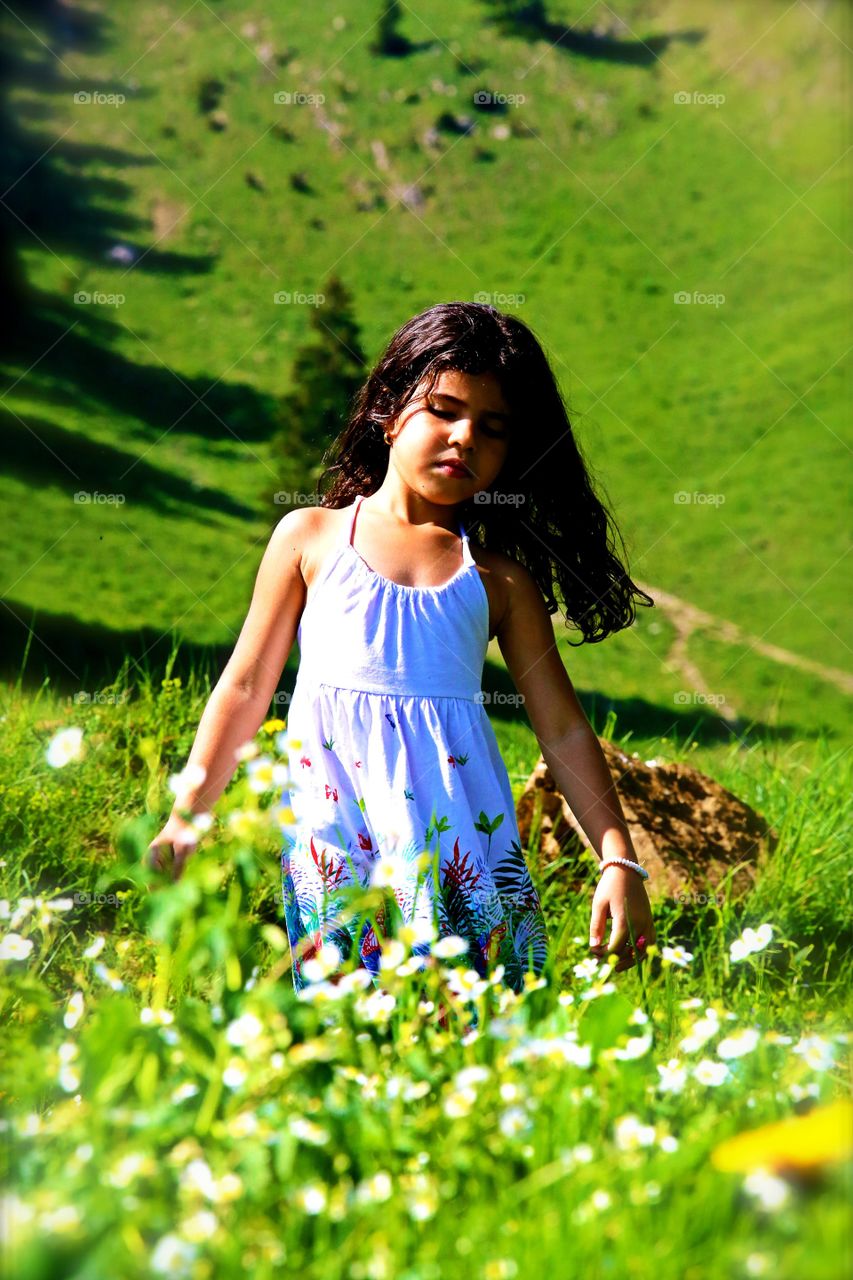 Cute girl walking in field