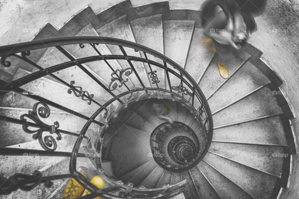 Winding staircase and yellow shoes