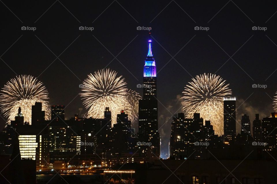 New York skyline on the Fourth of July. Fireworks behind Manhattan skyline on the Fourth of July