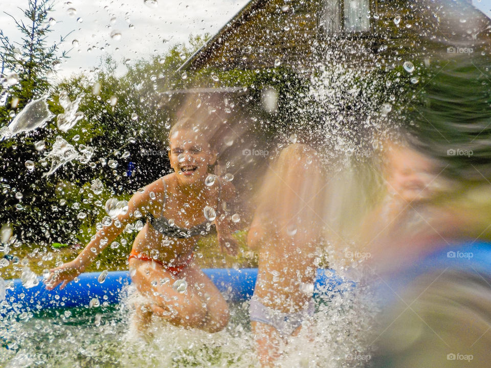 A lot of splashes and sprays in garden pool