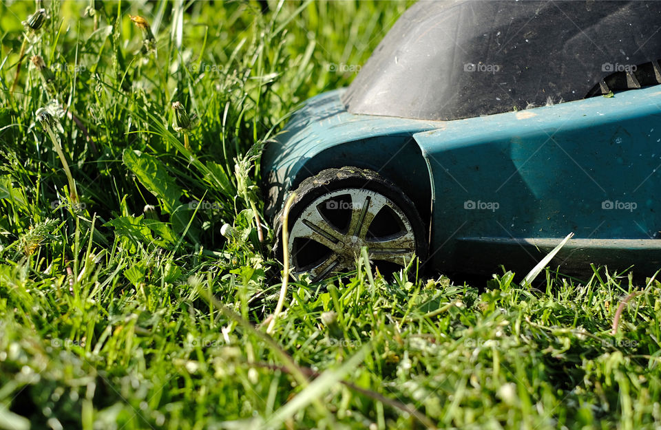 lawnmower mowing grass