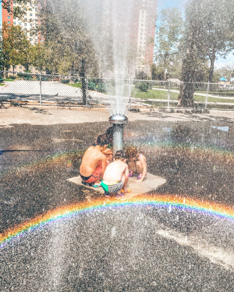 Summertime fun in the sprinklers 