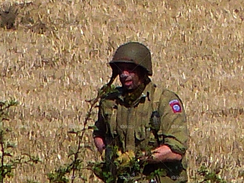 GI army soldier with helmet and rifle