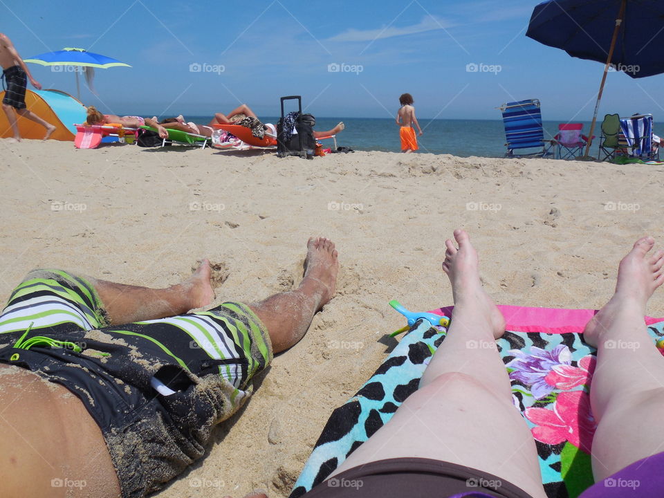 Enjoying laying on the beach sand and sun