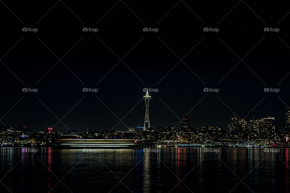 Long exposure Seattle night skyline with passing Ferry boat. 