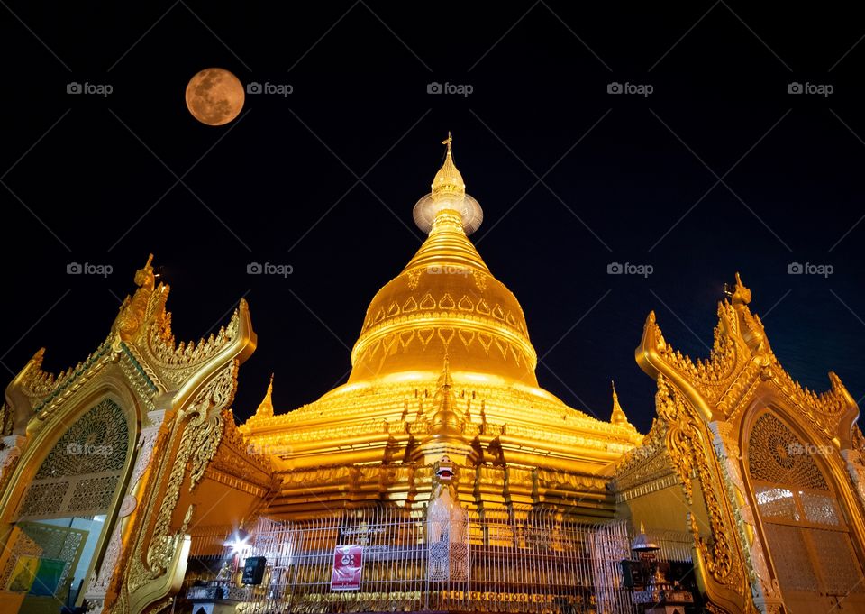 Golden night , Beautiful full moon light over Maha Wizaya Pagoda in Rangoon Myanmar