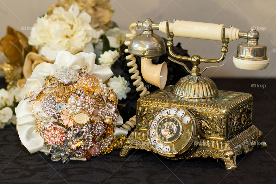 Vintage telephone and a broach bouquet