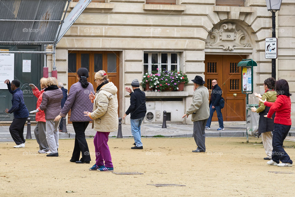 Elderly people practicing Taichi in Paris 