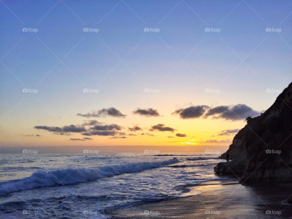 Waves at beach during the sunset