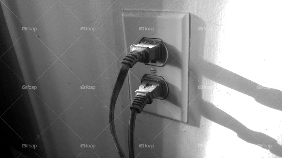 Black plugs in electric sockets