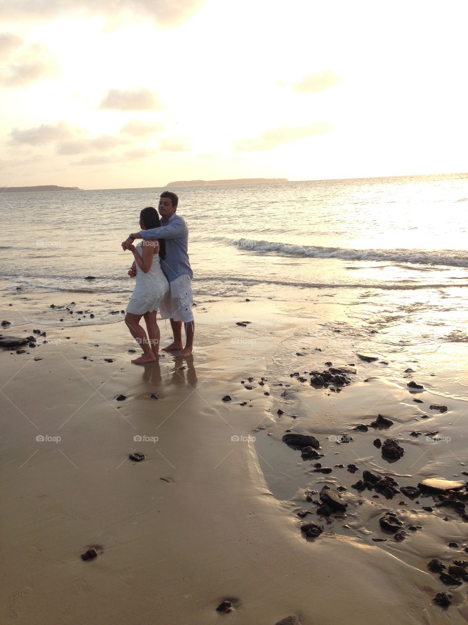 Couple and the sunset on the beach 