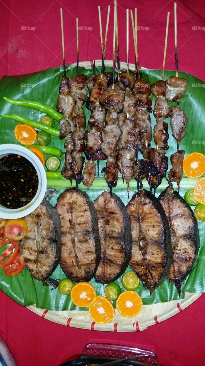 Grilled tuna steaks and pork barbecue on a stick...