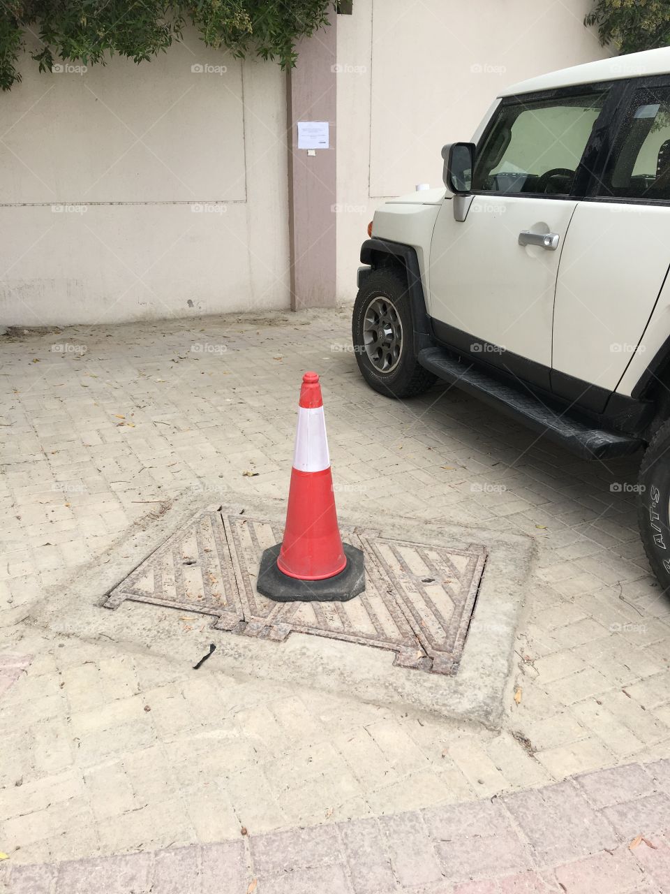 Manhole in car parking area