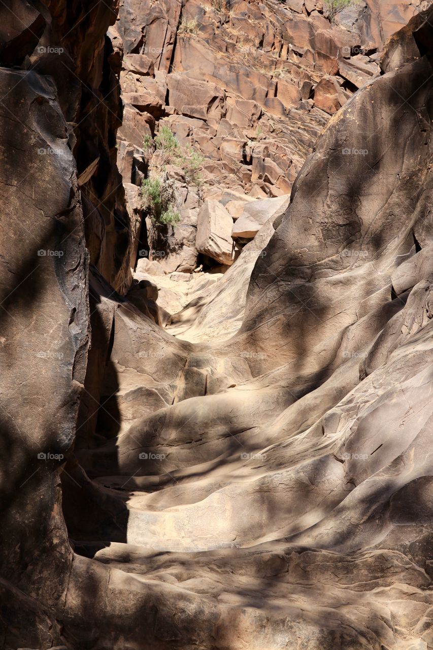 Ancient geological canyon pass at Sacred Canyon, a sacred aboriginal location at Flinders National Park bear Wilpena Pound in South Australia; aboriginal hieroglyphic markings can also be seen here 