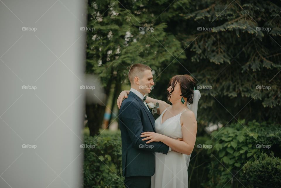 A happy moment of the bride and groom at the photo shoot