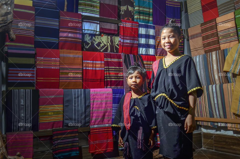 portrait of two girls wearing traditional "SASAK" clothes in Lombok, Indonesia.