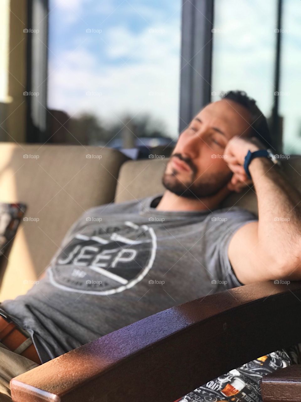 Relaxed man on patio in the summer