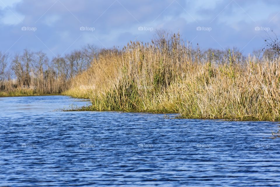 Idyllic lake against cloudy sky