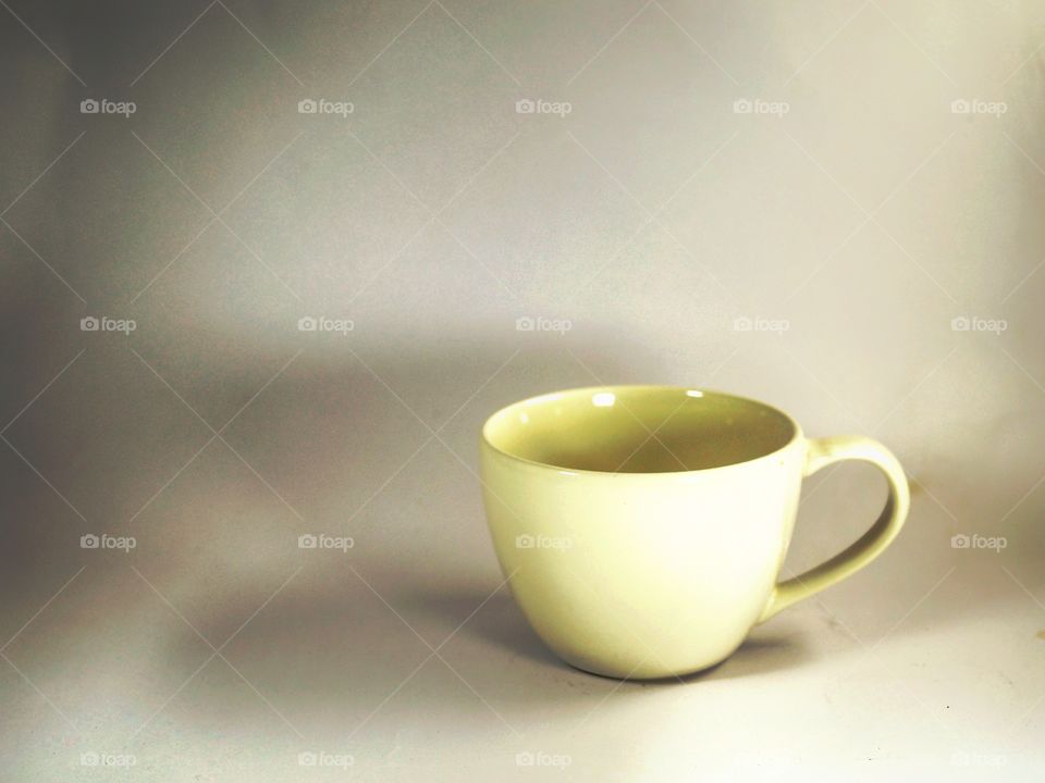 Blank coffee cup on the shadow background
