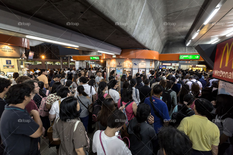 People in rush hour in BTS public train station 