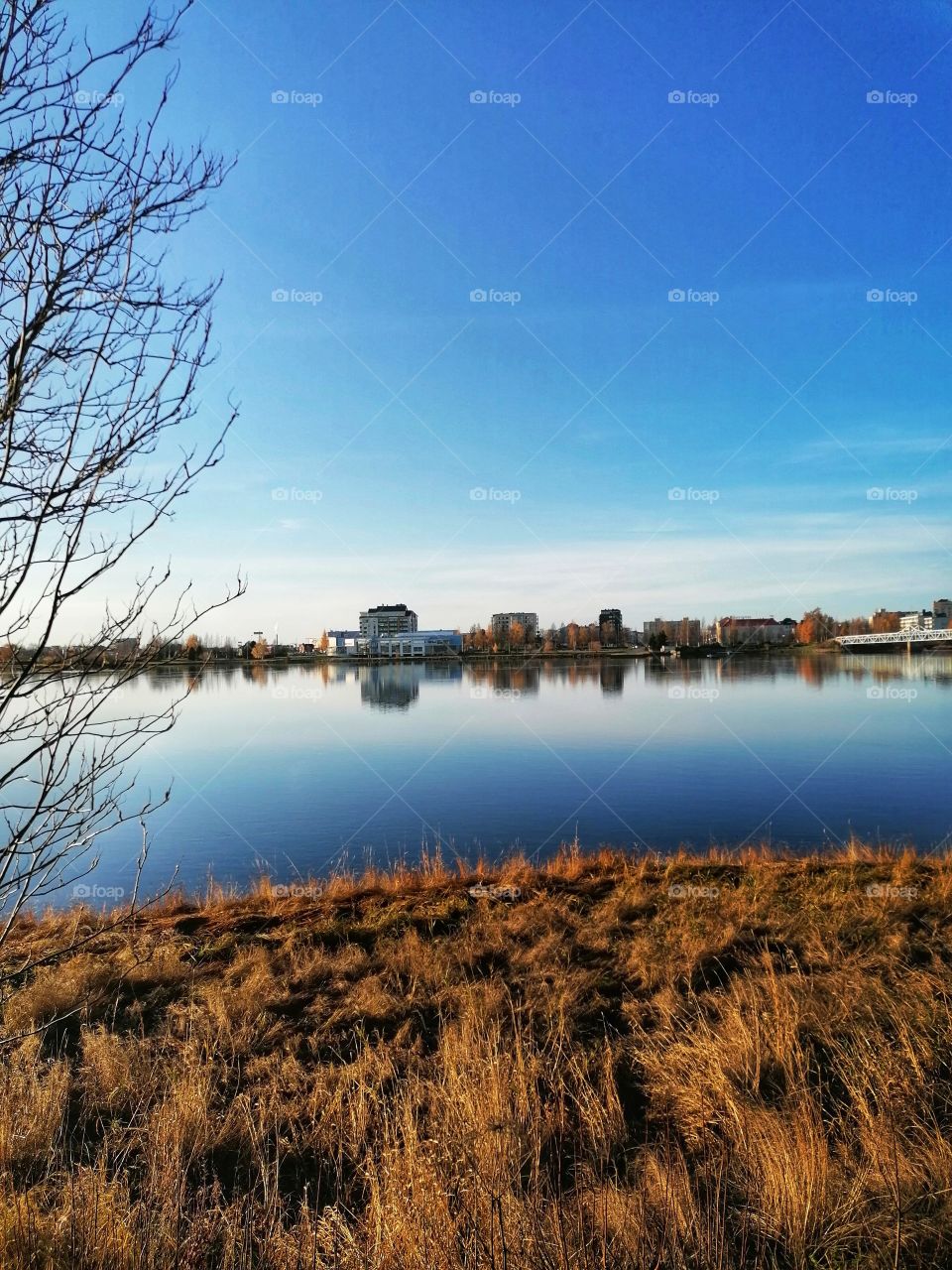 Great view on the Tornio River, Lapland, Finland in autumn. The Finnish-Swedish border is shown on the left.