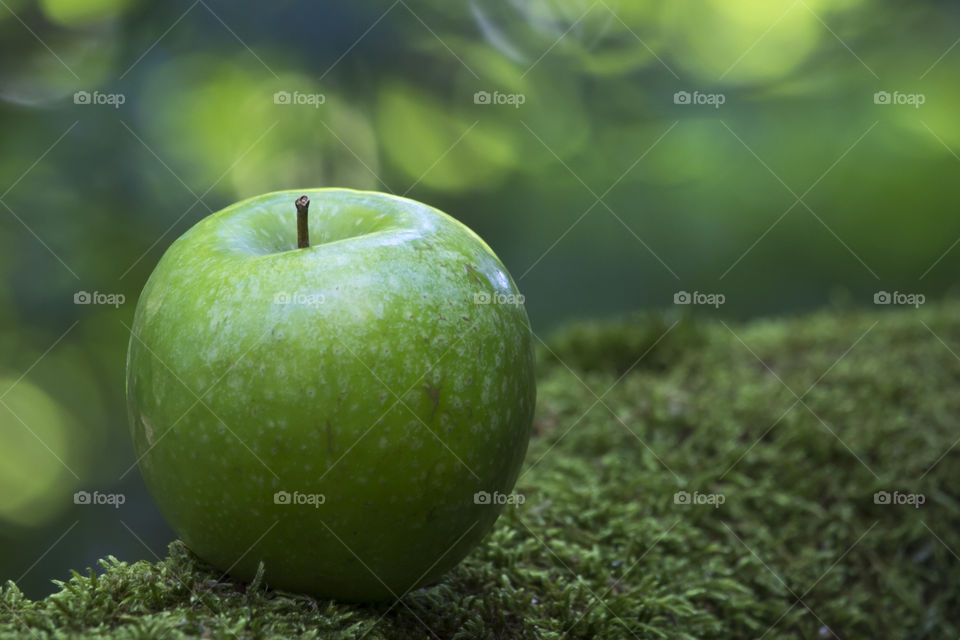 Green apple in green nature 