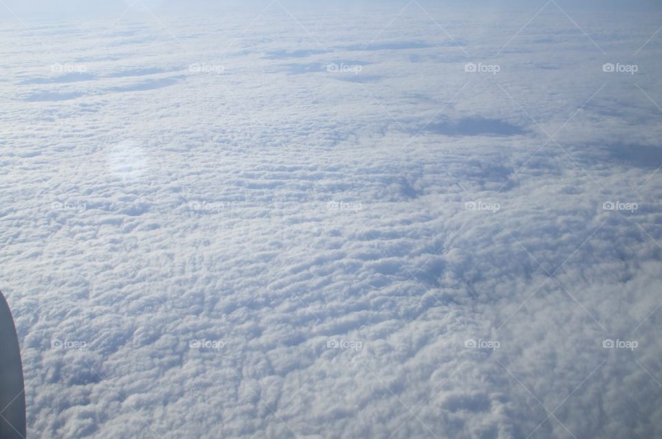 Above the clouds somewhere over the Pacific Ocean