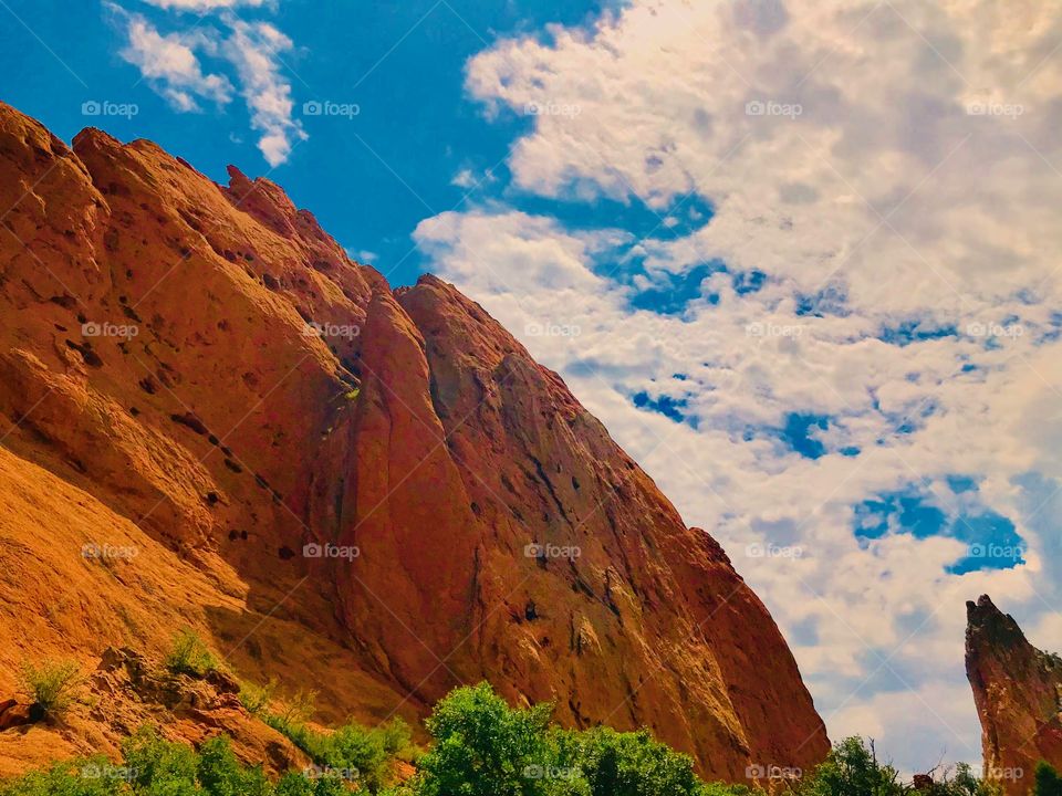 A rock climber can be seen climbing this Rock Formations if you look very closely. This was at garden of the gods in Colorado Springs, Colorado. It was a beautiful summer day for a hike.