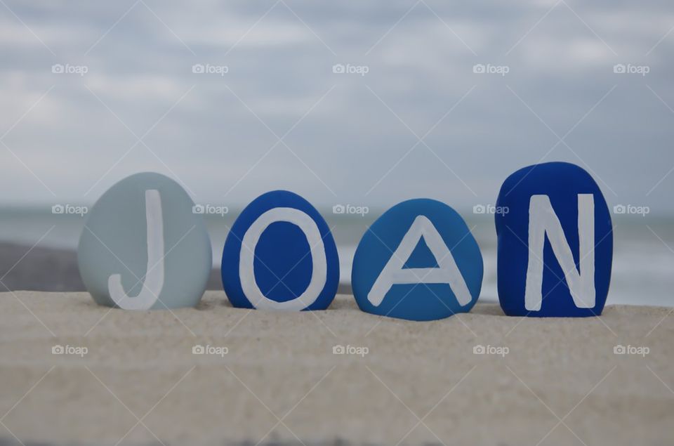 Joan, name on colored stones