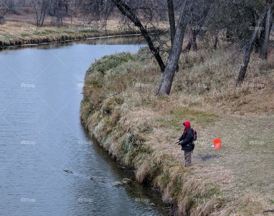 Fishing on the river in autumn