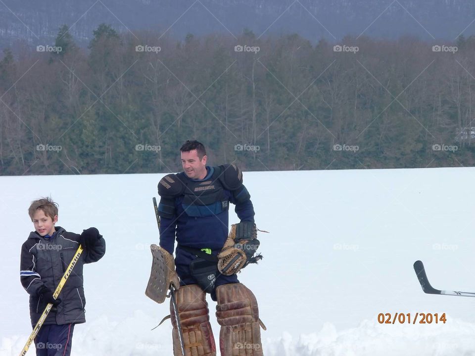 pond hockey. playing pond hockey up at the cabins