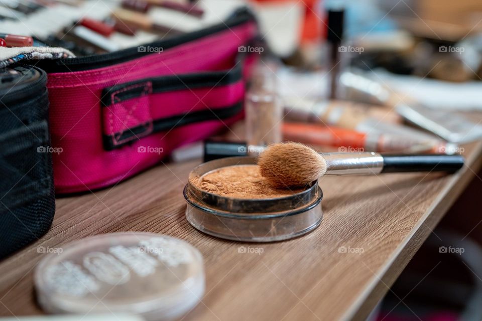 Makeup artist at work.  Applying makeup to a woman.  Professional cosmetics