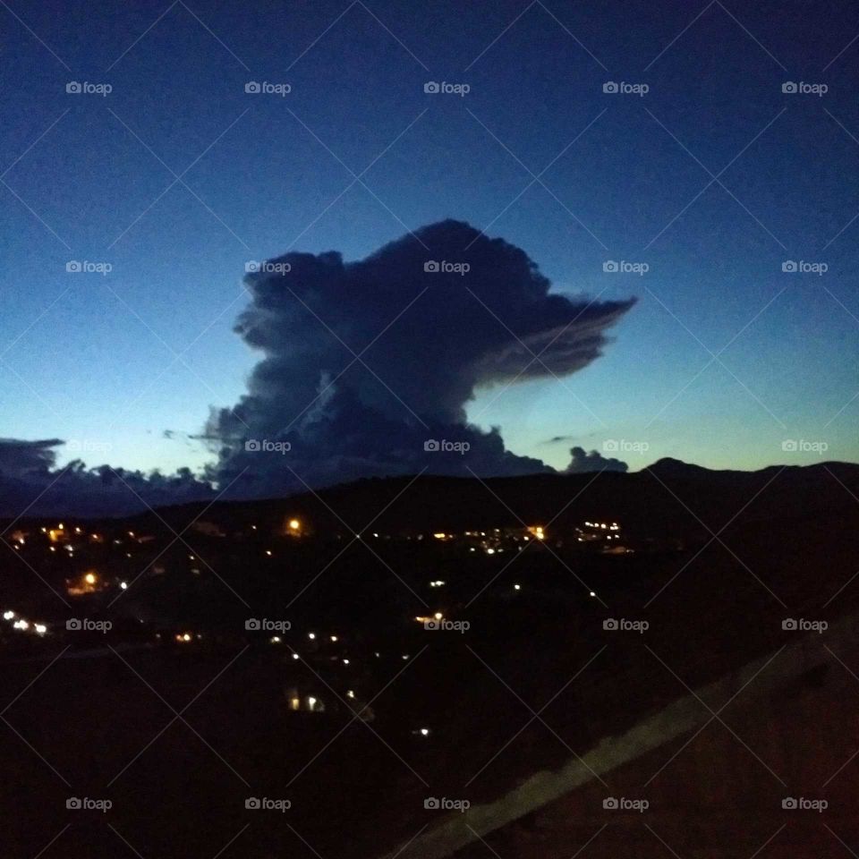 dog-shaped cloud at dusk on the mountain