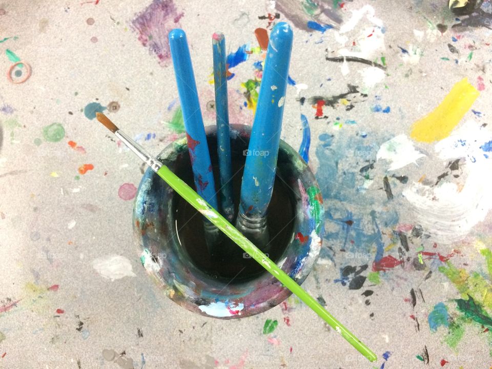 Paintbrushes in ceramic pot