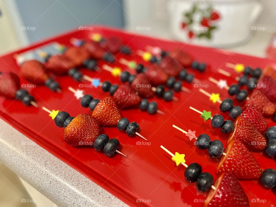 Fourth of July dessert, fruit skewers on a platter, party platter, Fourth of July party fruit skewers on a red platter 