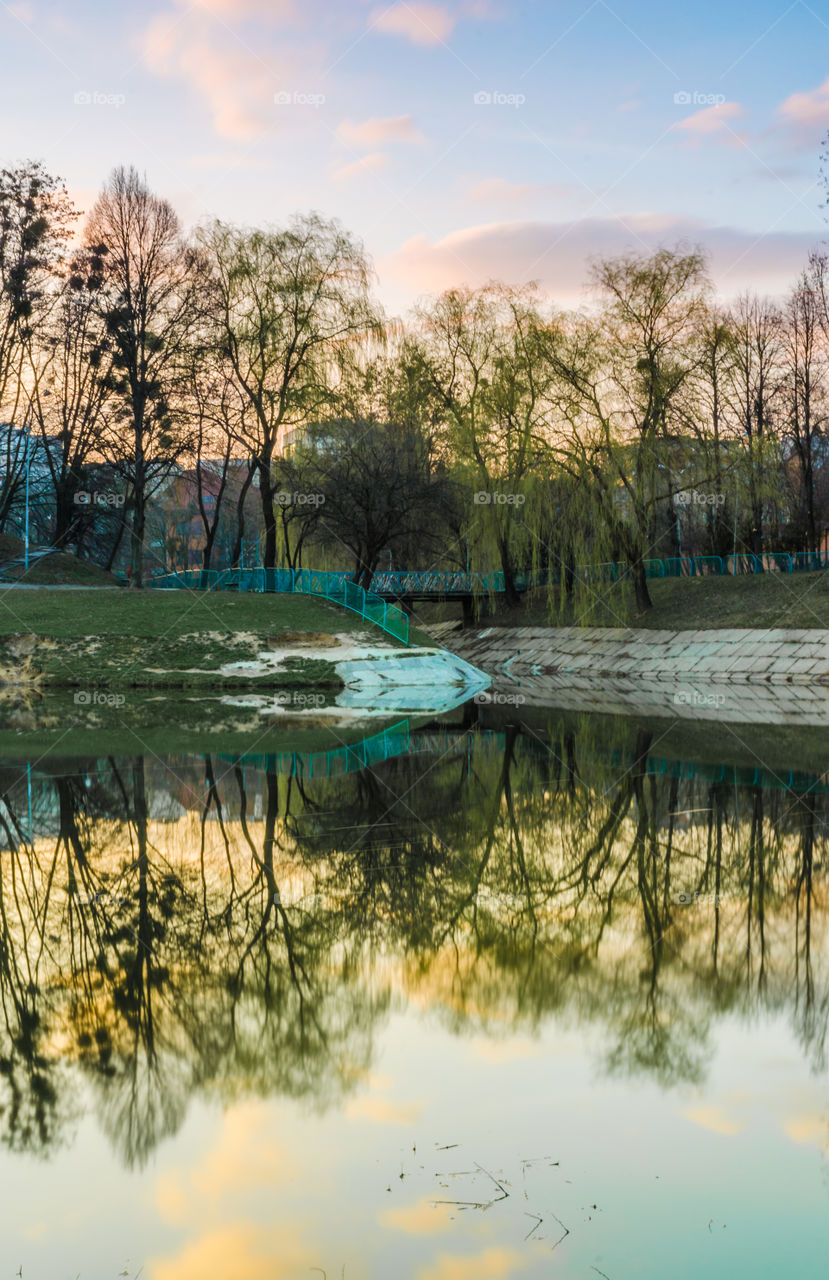 city park with lake in the spring season