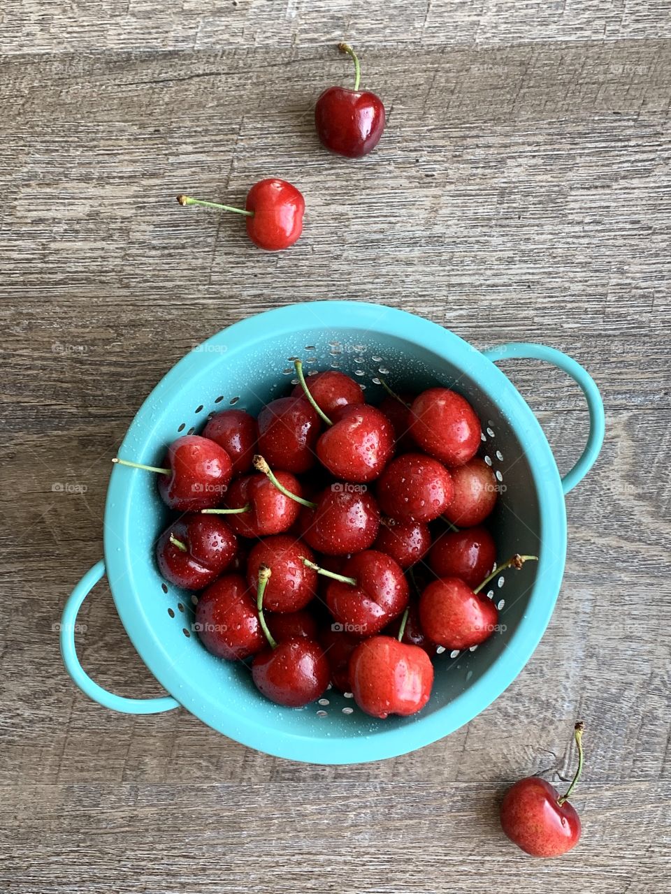 Red Cherries in colander 