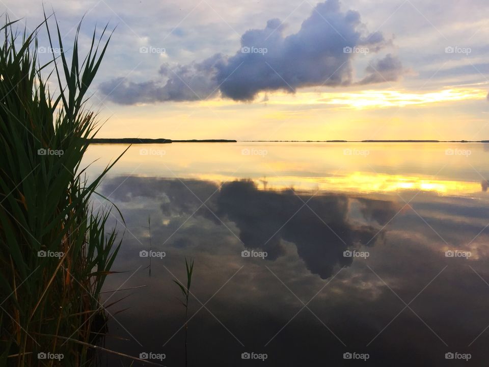 Dramatic clouds reflecting on the lake