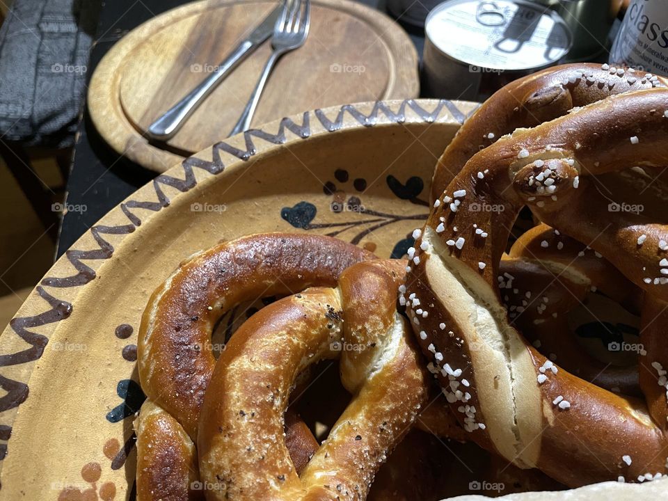 Close up of fresh pretzel in basket on Table