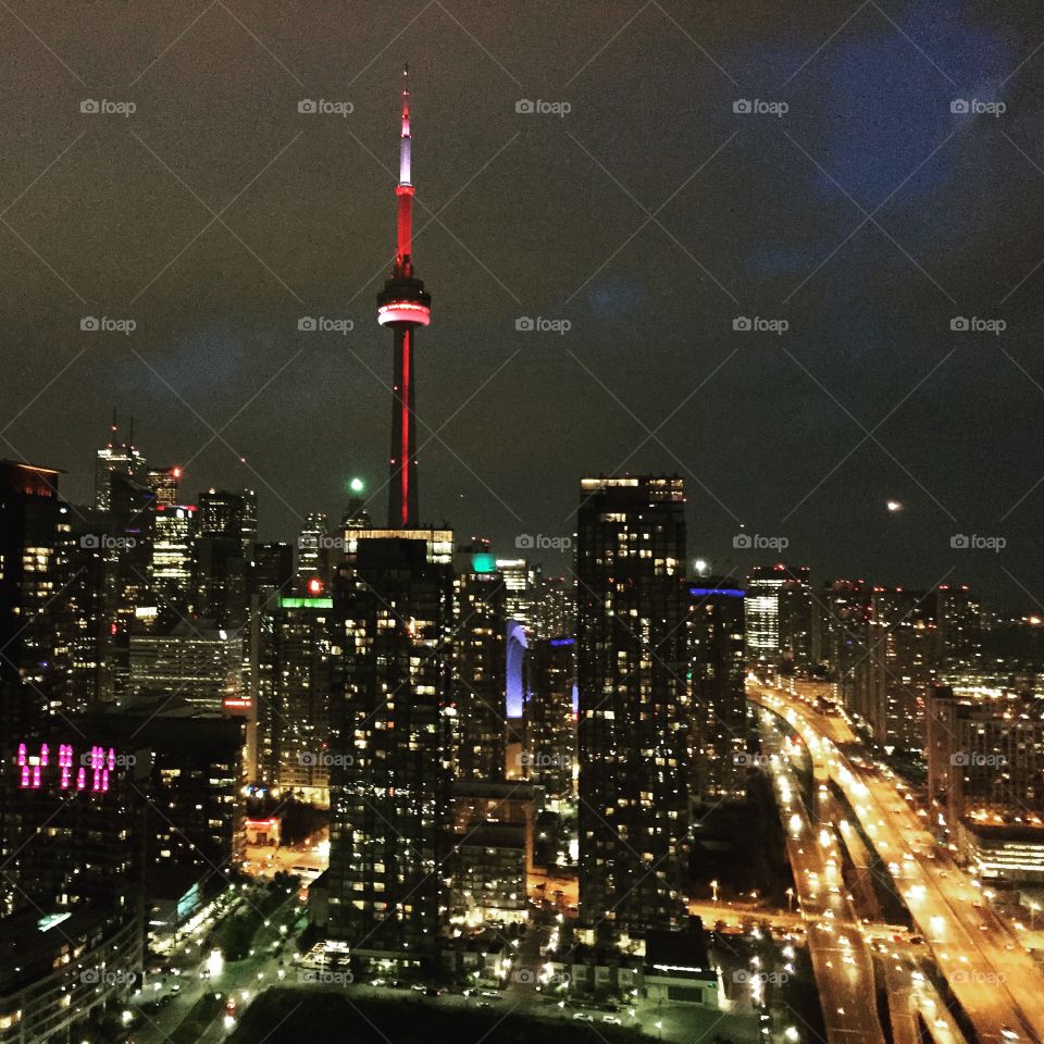 Night pulse in Toronto. City lights, traffic and CN Tower. Cool view. 