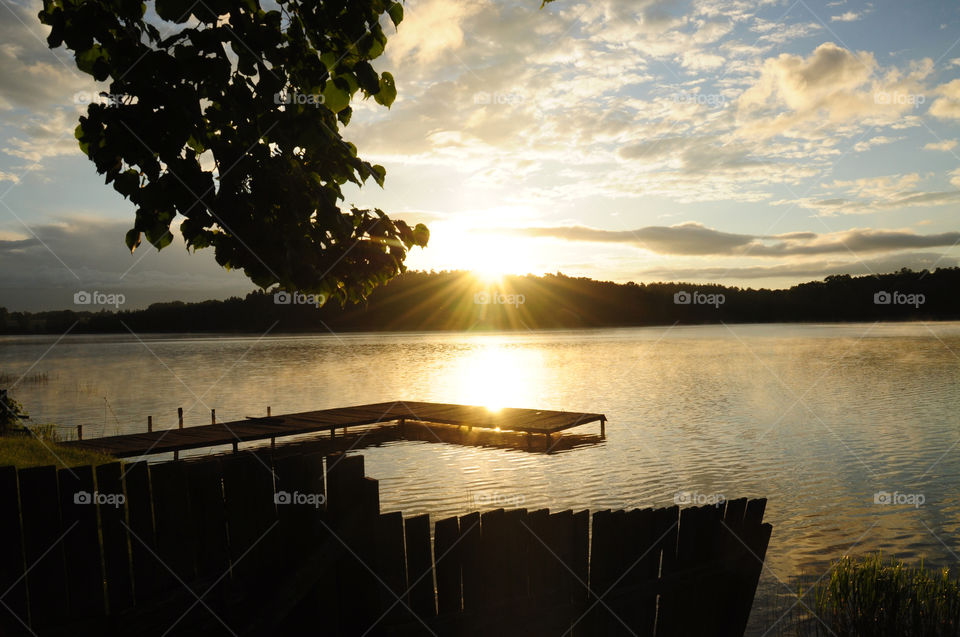 sunrise silhouettes at the lakeside