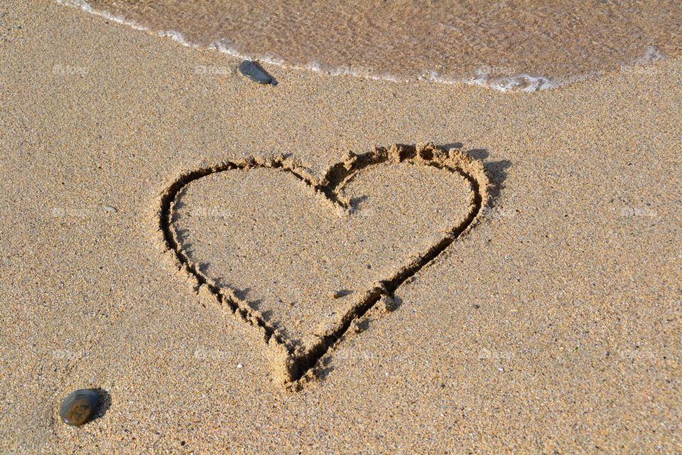 Heart written in the sand