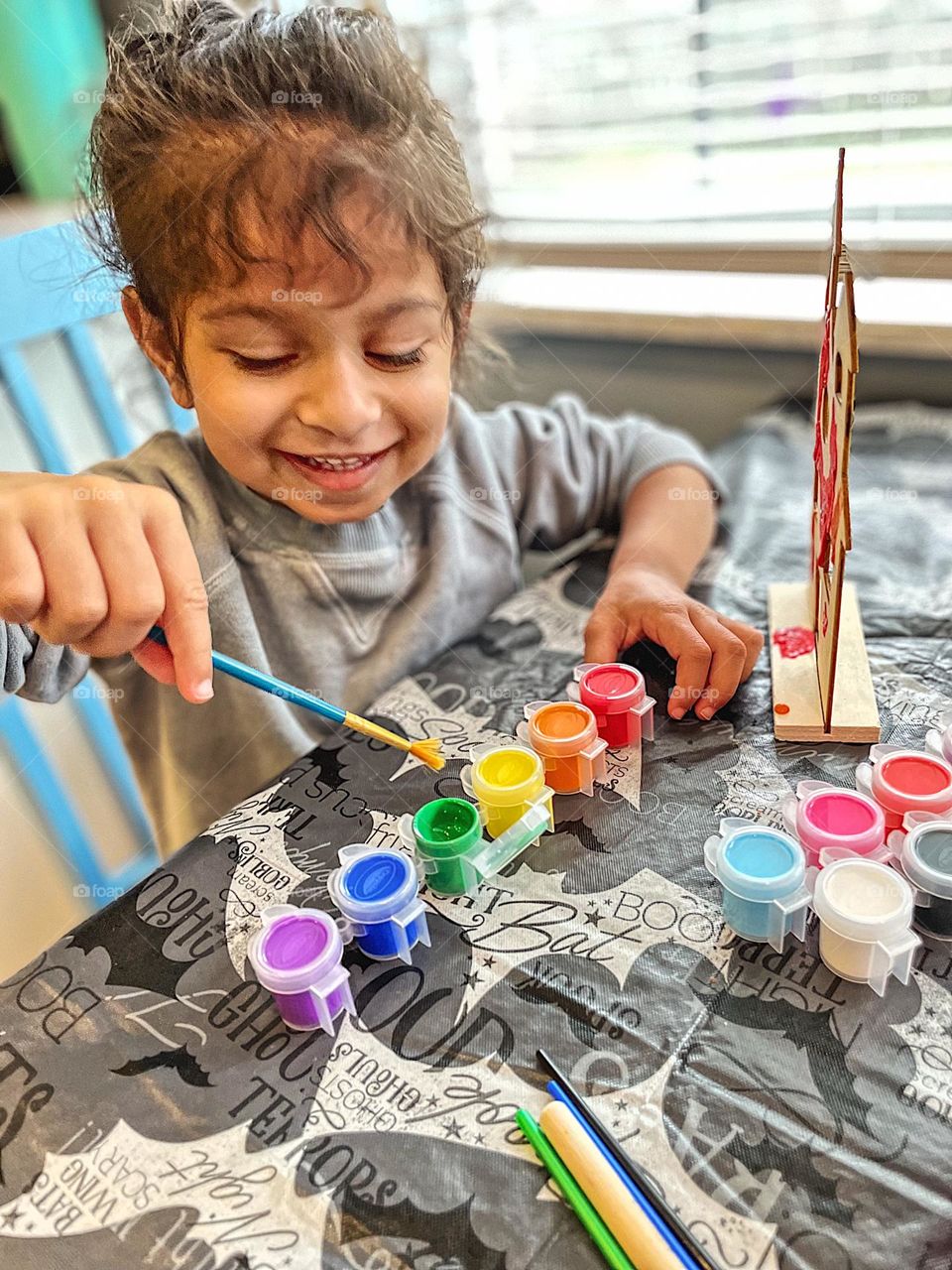 Toddler is happy painting, toddler paints crafts, crafts with children, indoor crafts with kids 