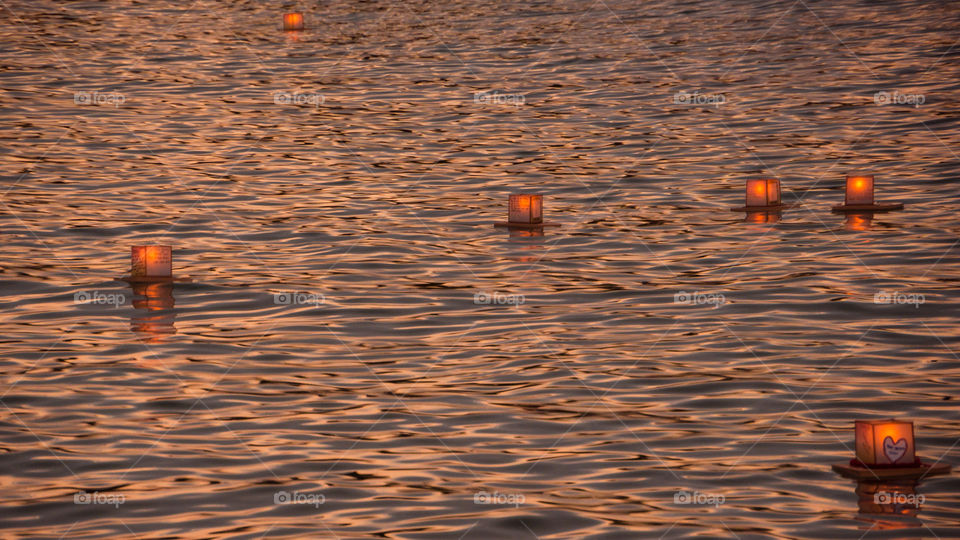 Floating lanterns magic hour. Ala moana beach Hawaiian ceremony Memorial Day magic hour floating lanterns 