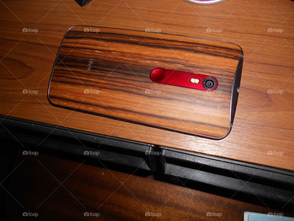 I have this phone for 2 years—the Moto X Pure Edition (Walnut Back). It blends in well.